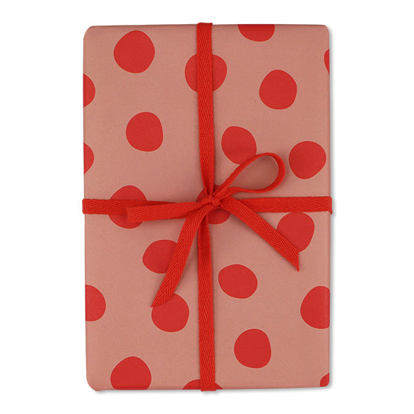 Geschenkpapier rosa mit großen roten Punkten